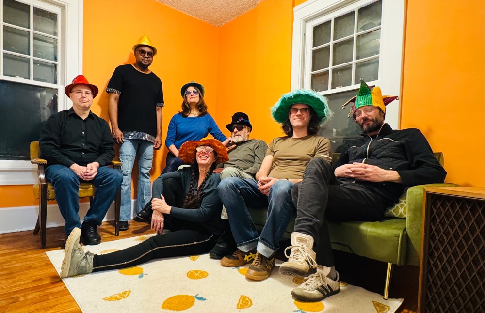 The members of Mo' Mojo in festive hats